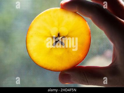 Slice of Apple showing seed distribution star pattern Stock Photo