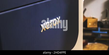 Kharkov, Ukraine - December 24, 2021: Xerox logo close-up. Large high volume printer in print house workshop Stock Photo