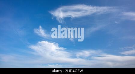 Clouds forming in a blue sky Stock Photo