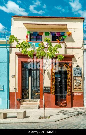 Colorful colonial architecture and Day of the Dead decorations in the historic center of Oaxaca Stock Photo
