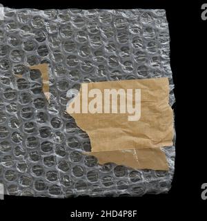 Bubble wrap plastic and adhesive tape on black background. Design element. Stock Photo