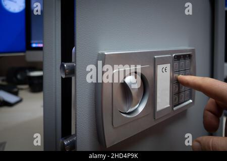 a code is entered on the pinpad of a safe Stock Photo