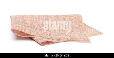 Sintetic folded kitchen napkin isolated on white. Stock Photo