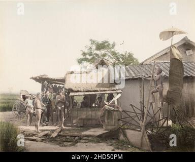 Vintage 19th century photograph:  Roadside rest place, food stall, and rwater wheel, treadmill, Japan Stock Photo