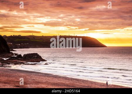 Sunset over the beach at Tresaith in Ceredigion in Wales. Stock Photo
