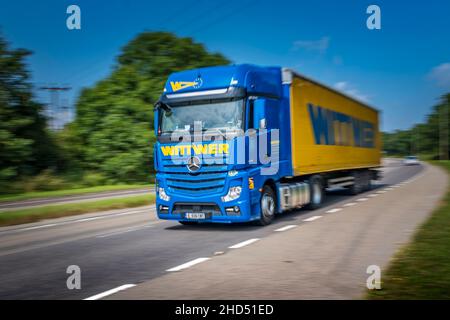 A Wittwer Spedition and Logistik GmbH articulated lorry at speed on a dual carriageway. Stock Photo