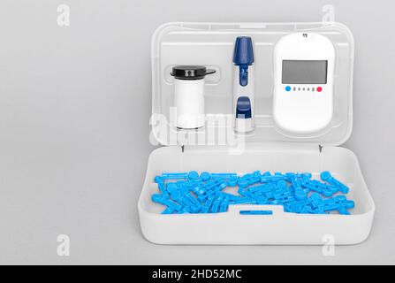 Glucometer, home kit for measuring blood sugar. Stock Photo