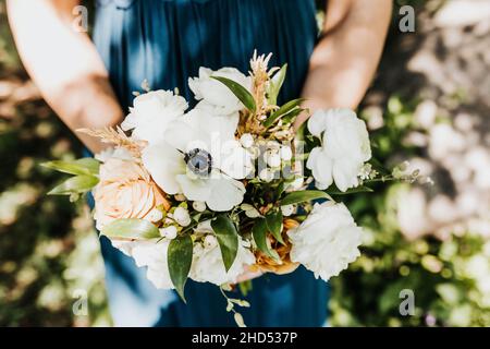 Overhead shot of white, pink, and blue floral bouquet Stock Photo