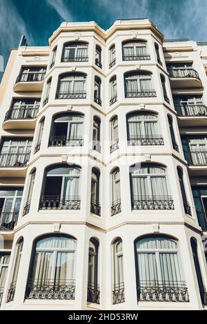 Facade of a hotel with many windows Stock Photo