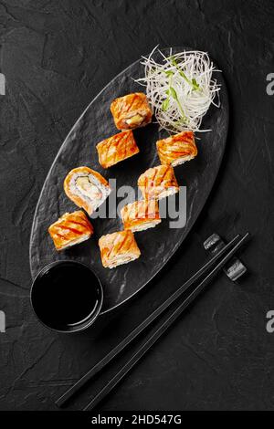 Top view of sushi rolls with seared salmon, cream cheese, apple Stock Photo