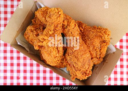 Top View of Takeaway Box filled with delectable golden-brown fried chickens Stock Photo