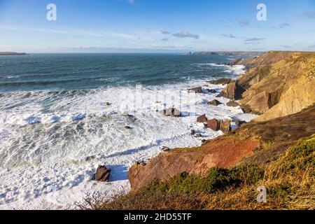 The Pembrokeshire Coast at high-tide with Skomer Island in the background. South Wales Stock Photo