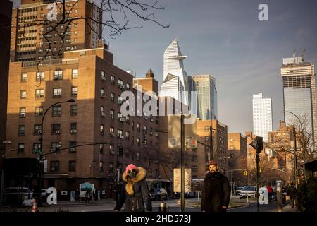 The massive Hudson Yards development looms over the NYCHA Fulton Houses complex of apartments in Chelsea in New York on Friday, December 24, 2021.  (© Richard B. Levine) Stock Photo