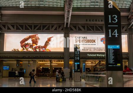 Advertising for Ceasar’s Sportsbook, online sports gambling, in the Moynihan Train Hall of Pennsylvania Station in New York on Wednesday, December 29, 2021. Although approved by the legislature, the New York State Gaming Commission has not set a definitive start date for online sports betting. (© Richard B. Levine) Stock Photo