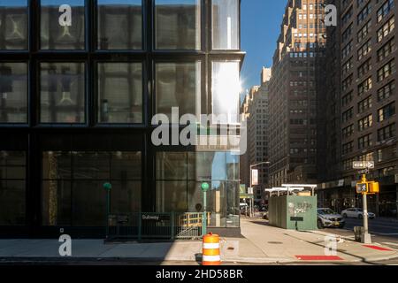 Subway entrance next to new construction in the Chelsea neighborhood of New York  on Sunday, December 26, 2021. (© Richard B. Levine) Stock Photo