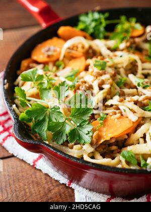 Carrots and Lentils with German Pasta (Spaetzle) in a cast iron pan