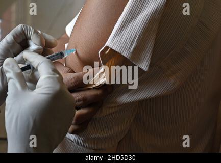 Mumbai, India. 03rd Jan, 2022. A health worker administers a dose of Covaxin vaccine to a student of Sainath school in Navi Mumbai.Vaccination for children in the age group of 15-18 years of age was launched in India. Credit: SOPA Images Limited/Alamy Live News Stock Photo