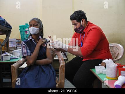 Mumbai, India. 03rd Jan, 2022. A health worker administers a dose of Covaxin vaccine to a student of Sainath school in Navi Mumbai.Vaccination for children in the age group of 15-18 years of age was launched in India. Credit: SOPA Images Limited/Alamy Live News Stock Photo