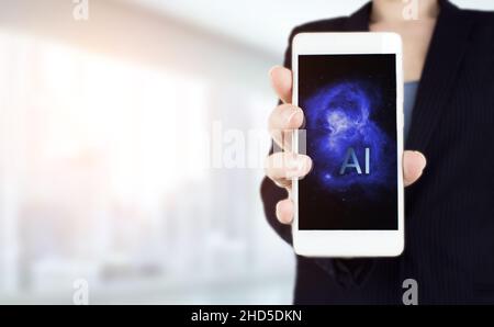 The modern concept of the cyberbrain. Hand hold white smartphone with digital hologram Artificial intelligence sign on light blurred background. Virtu Stock Photo