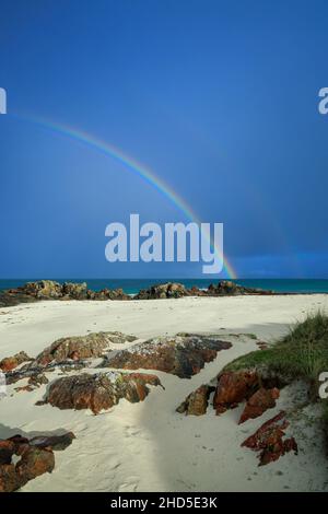 Rainbow over Traigh an t-Suidhe beach on the Isle of Iona. Stock Photo
