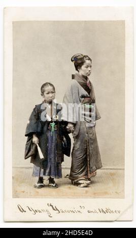 19th century vintage photograph - 1860's Japan carte de visite attributed to Felix Beato studio: young boy of samurai class and mother. Stock Photo