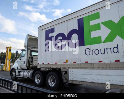 Friday Harbor, WA USA - circa November 2021: View of a FedEx freight truck boarding a Washington State Ferry on a bright, sunny day. Stock Photo