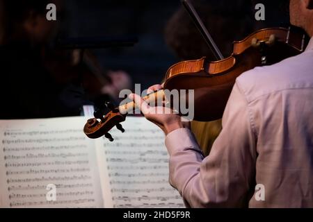 A violinist from the Kernow Chamber Players performing at Trebah Garden Amphitheatre in Cornwall. Stock Photo