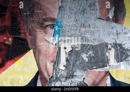 Cherbourg-en-Cotentin, Normandy, France. 24th Dec, 2021. Posters of Fabien Roussel, candidate of the French communist party for the presidential election of 2022 are seen torn down.The election of the President of the French Republic will take place on Sunday, April 10, 2022 for the first round and on Sunday, April 24, 2022 for the second round.In Guadeloupe, Martinique, French Guiana, St. Pierre and Miquelon, St. Barthélemy, St. Martin and French Polynesia, voters will vote on Saturday, April 9 and Saturday, April 23 due to the time difference. (Credit Image: © Laurent Coust/SOPA Images Stock Photo