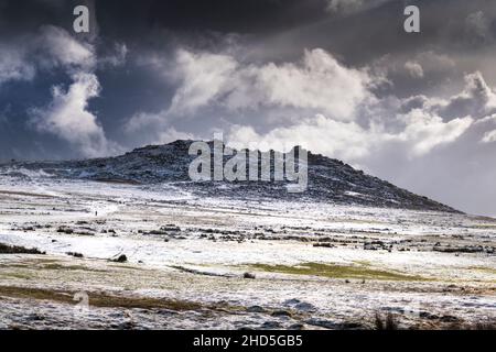 Snow on the wild rugged Rough Tor on Bodmin Moor in Cornwall. Stock Photo