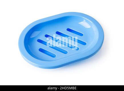 Empty blue soap dish isolated on a white background. New rounded soap holder with drain for bathroom and shower. Washing hands with soap, purity. Stock Photo