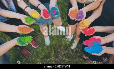 Holi paints in the hands of girls. Stock Photo