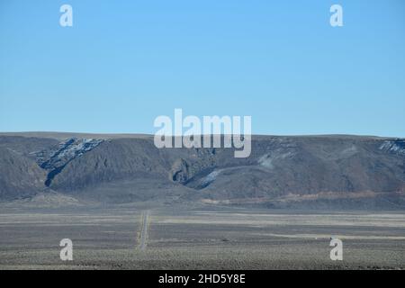 The approach to the dramatic steep cliffs of Sage Butte on the remote Adel-Denio road (OR-140, Warner Highway) in southern Oregon, United States. Stock Photo