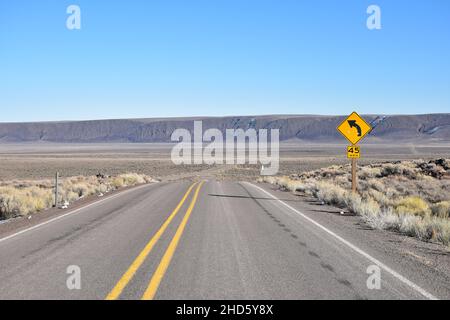 The approach to the dramatic steep cliffs of Sage Butte on the remote Adel-Denio road (OR-140, Warner Highway) in southern Oregon, United States. Stock Photo