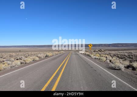 The approach to the dramatic steep cliffs of Sage Butte on the remote Adel-Denio road (OR-140, Warner Highway) in southern Oregon, United States. Stock Photo