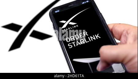 Redmond, Washington, USA, November 2021: ordering a Starlink product using a smart phone. Starlink (SpaceX) is a satellite communications system Stock Photo