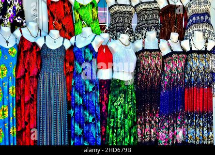 Colorful ladies dresses in a store front window on Vancouver Island British Columbia Canada Stock Photo