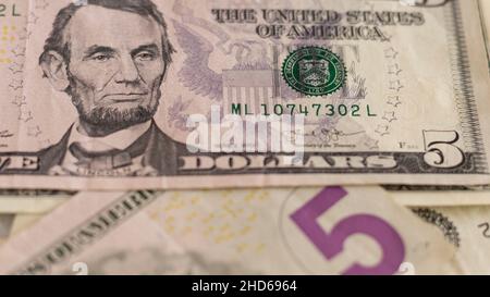 USD Five dollar bill with selective focus and blurred background Stock Photo