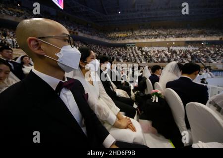 Feb 07, 2020-Gapyeong, South Korea-Thousands of couples take part in a mass wedding of the Family Federation for World Peace and Unification, commonly known as the Unification Church, at Cheongshim Peace World Center in Gapyeong-gun, South Korea. Stock Photo