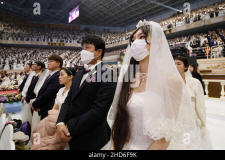Feb 07, 2020-Gapyeong, South Korea-Thousands of couples take part in a mass wedding of the Family Federation for World Peace and Unification, commonly known as the Unification Church, at Cheongshim Peace World Center in Gapyeong-gun, South Korea. Stock Photo