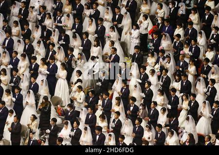 Feb 07, 2020-Gapyeong, South Korea-Thousands of couples take part in a mass wedding of the Family Federation for World Peace and Unification, commonly known as the Unification Church, at Cheongshim Peace World Center in Gapyeong-gun, South Korea. Stock Photo