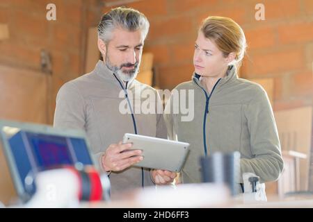 portrait of workers with digital tablet Stock Photo