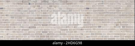 Brick wall of beige stone panorama background Stock Photo