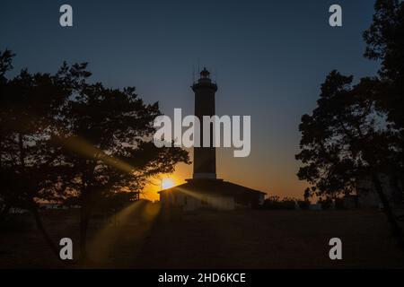 Sunset over the lighthouse of Veli Rat on the island of Dugi Otok, Croatia Stock Photo