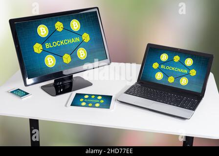 Blockchain concept shown on different information technology devices Stock Photo