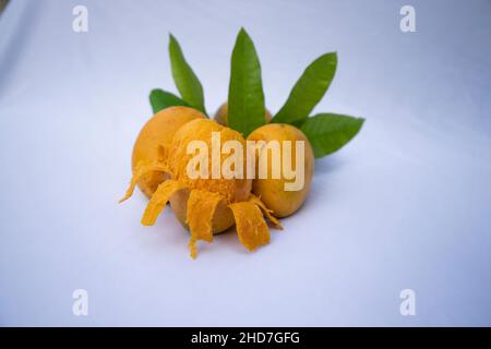 Fresh Delicious Slice Yellow Ripe Mango with Green leaf on isolated Background Stock Photo