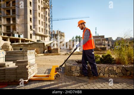 Male worker making concrete at construction site Stock Photo