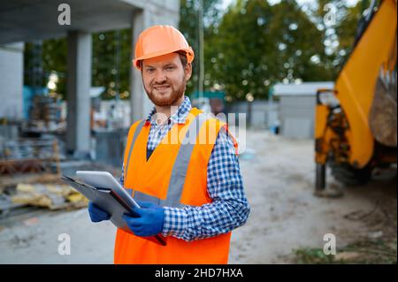 Portrait of construction worker holding digital tablet Stock Photo
