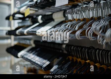 Variety of clothes hanger shop assortment display Stock Photo