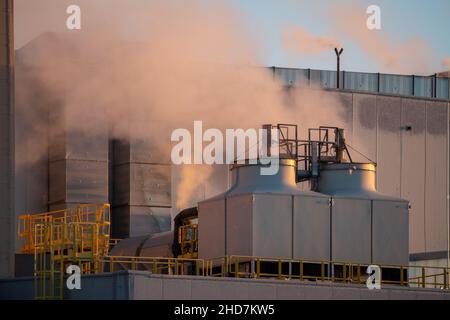 Hot steam gushing from the waste incineration plant Stock Photo