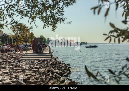 BARDOLINO, ITALY 16 SEPTEMBER 2020: Panorama of Beach on Garda Lake of Bardolino Stock Photo